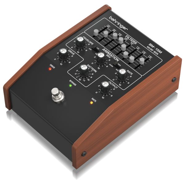 Behringer audio effect pedal with wooden casing on a white background