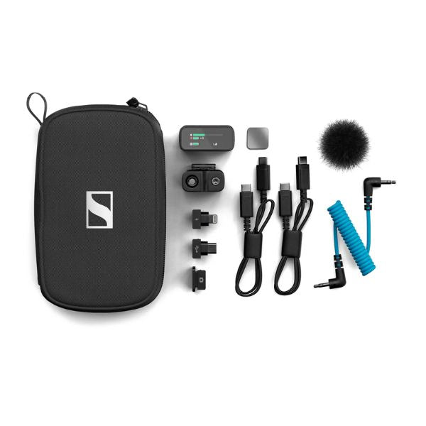 Collection of Sennheiser audio equipment including a case, microphone, and cables on a white background.