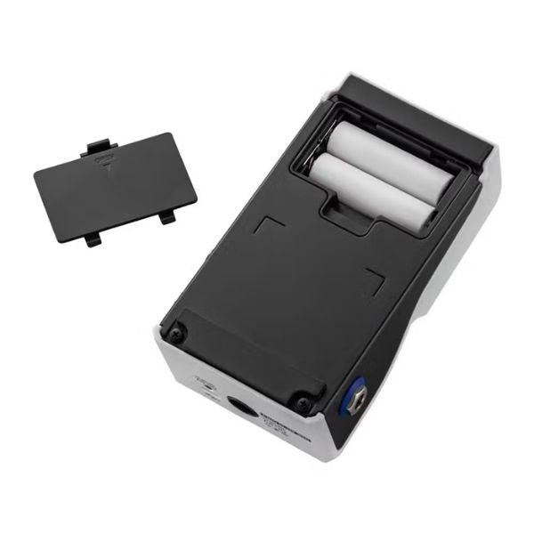 Small electronic device with a black cover and white components on a white background