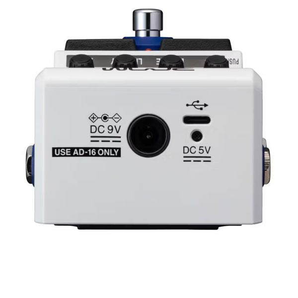 White guitar effects pedal with labeled ports on a white background
